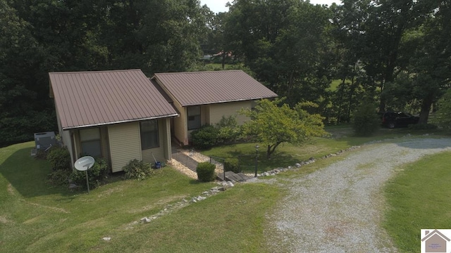 250 Jan Ann Dr, Paducah, KY 42003 - view of front facade featuring a front lawn, metal roof, and cooling unit