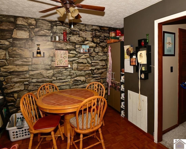 250 Jan Ann Dr, Paducah, KY 42003 - dining space featuring ceiling fan, a textured ceiling, and baseboards