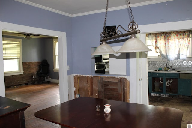 4045 Husband Rd, Paducah, KY 42003 - dining space with ornamental molding, wood finished floors, ceiling fan, and a wood stove