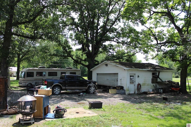 4045 Husband Rd, Paducah, KY 42003 - rear view of house with an outbuilding and a detached garage