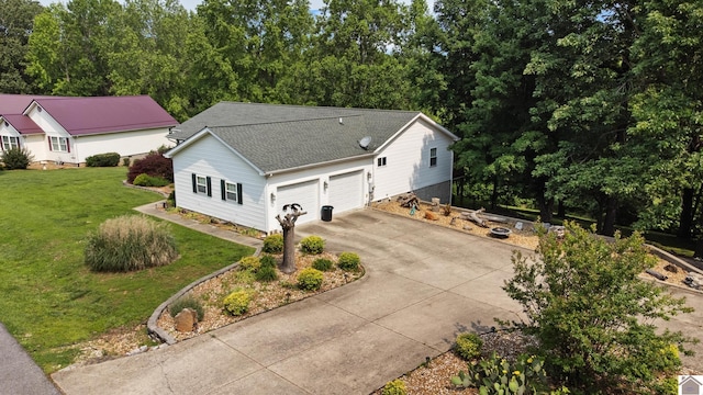 68 Lazy K Ln, Kuttawa, KY 42055 - view of front of home with roof with shingles, driveway, a front yard, and a garage