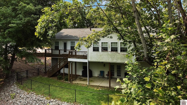 68 Lazy K Ln, Kuttawa, KY 42055 - rear view of house with french doors, a wooden deck, a fenced backyard, a patio, and stairs