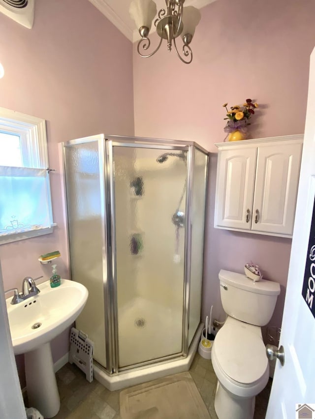 1722 Jefferson St, Paducah, KY 42001 - bathroom with a shower stall, toilet, a chandelier, and tile patterned flooring