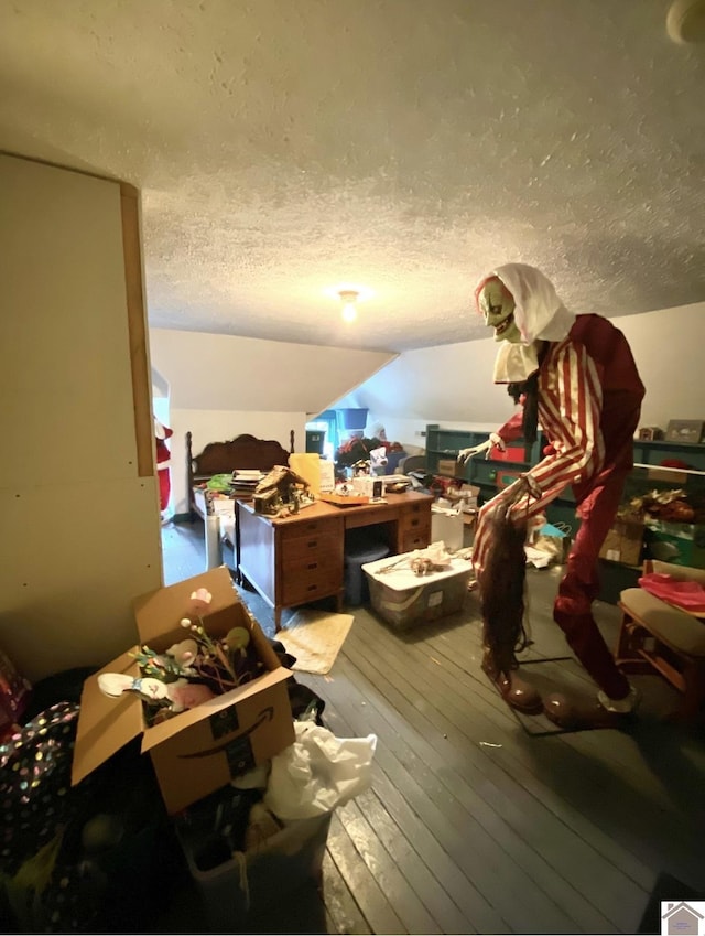 1722 Jefferson St, Paducah, KY 42001 - miscellaneous room with a textured ceiling, hardwood / wood-style floors, and lofted ceiling