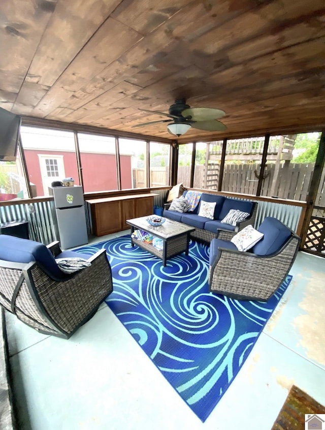 1722 Jefferson St, Paducah, KY 42001 - living area with wooden ceiling, finished concrete floors, and ceiling fan