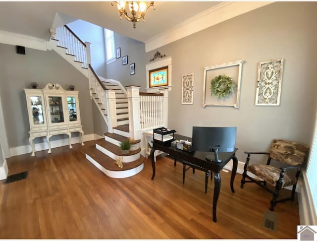 1722 Jefferson St, Paducah, KY 42001 - entryway with stairs, crown molding, a chandelier, wood finished floors, and baseboards