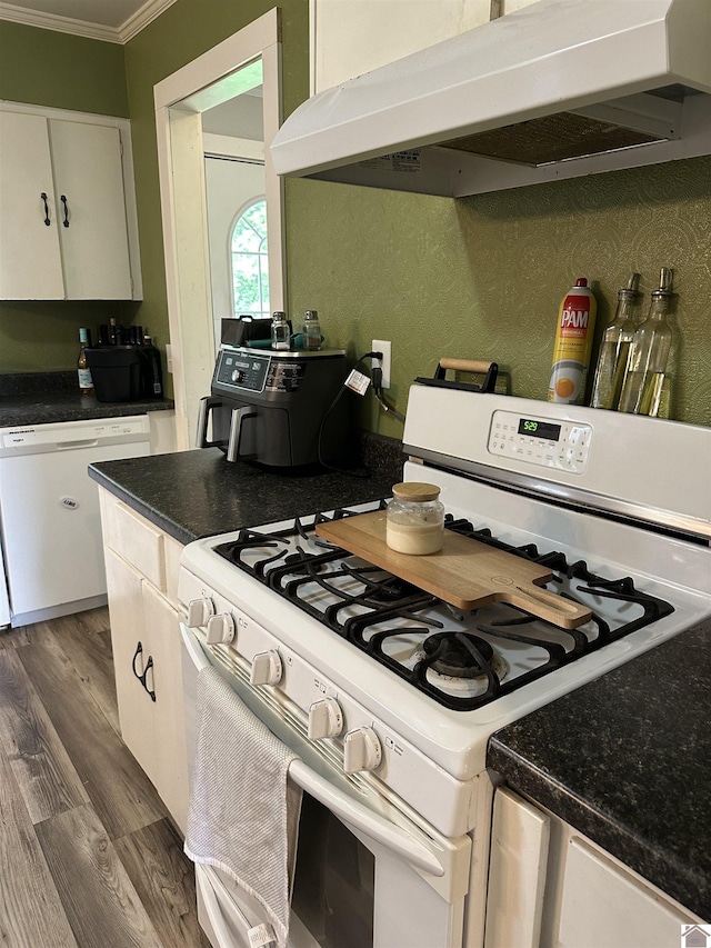260 Riverside Dr, Paducah, KY 42003 - kitchen with white appliances, ornamental molding, under cabinet range hood, dark wood-style floors, and white cabinets