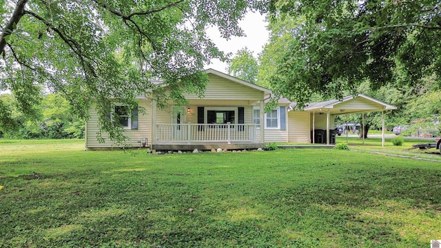 9740 Crotzer Rd, West Paducah, KY 42086 - view of front of house featuring a front yard, a porch, and an attached carport