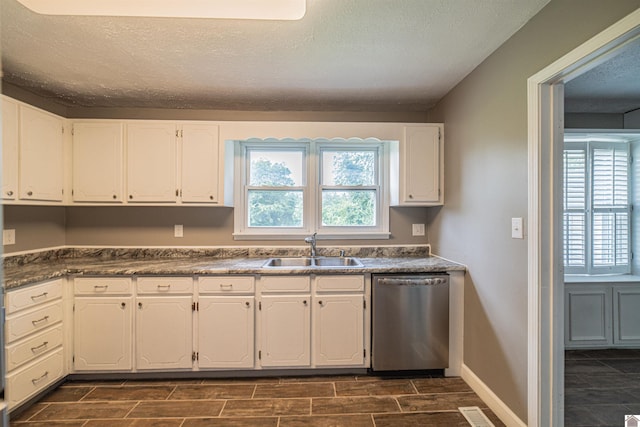 9740 Crotzer Rd, West Paducah, KY 42086 - kitchen with dishwasher, a sink, white cabinets, wood tiled floors, and a textured ceiling