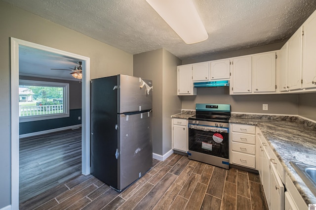 9740 Crotzer Rd, West Paducah, KY 42086 - kitchen featuring stainless steel appliances, under cabinet range hood, dark wood-style flooring, a textured ceiling, and white cabinets