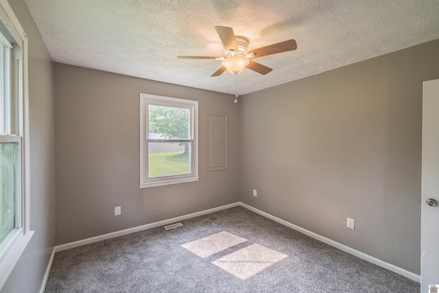 9740 Crotzer Rd, West Paducah, KY 42086 - spare room with a textured ceiling, a ceiling fan, carpet floors, and baseboards