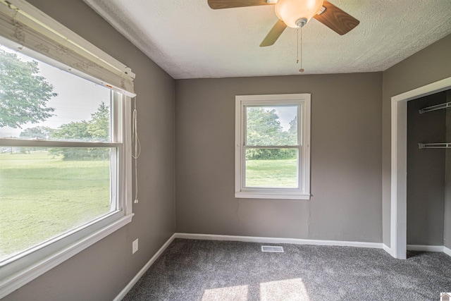9740 Crotzer Rd, West Paducah, KY 42086 - unfurnished bedroom featuring carpet floors, baseboards, a ceiling fan, and a textured ceiling