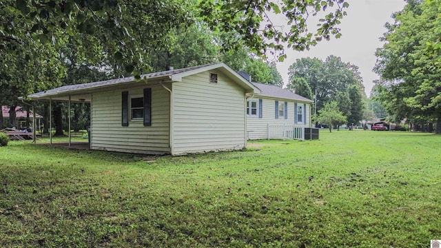 9740 Crotzer Rd, West Paducah, KY 42086 - view of side of home featuring a lawn, central AC unit, and view of scattered trees