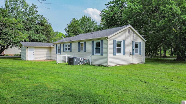 9740 Crotzer Rd, West Paducah, KY 42086 - back of property with a lawn and central AC unit