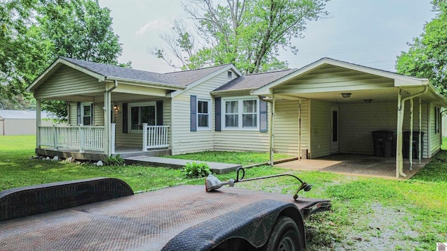 9740 Crotzer Rd, West Paducah, KY 42086 - single story home featuring covered porch, a front lawn, a shingled roof, and a carport