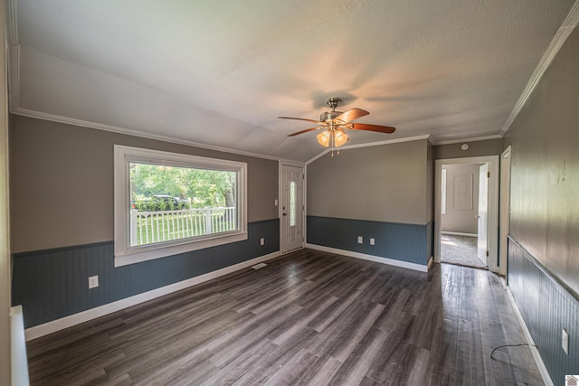 9740 Crotzer Rd, West Paducah, KY 42086 - empty room with dark wood-style flooring, ceiling fan, crown molding, wainscoting, and baseboards
