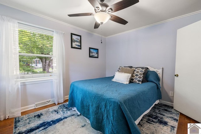 1310 Hilltop Dr, Mayfield, KY 42066 - bedroom featuring wood finished floors, ornamental molding, baseboards, and a ceiling fan