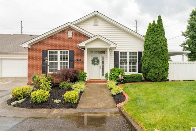 2492 Lakewood Dr, Paducah, KY 42003 - view of front of property with brick siding, a garage, and driveway