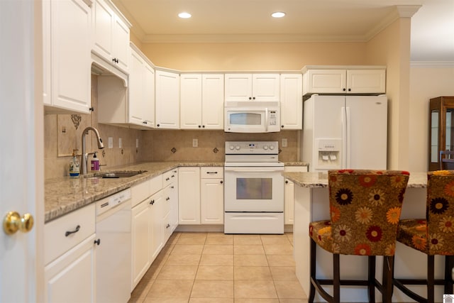 2492 Lakewood Dr, Paducah, KY 42003 - kitchen featuring white appliances, a sink, crown molding, white cabinets, and light tile patterned floors