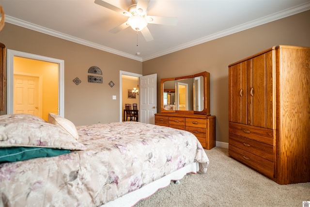 2492 Lakewood Dr, Paducah, KY 42003 - bedroom featuring light colored carpet, ornamental molding, ceiling fan, and baseboards
