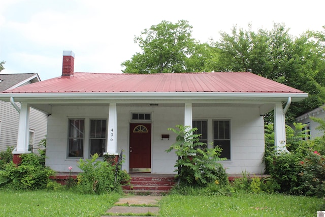 406 S 19, Paducah, KY 42003 - view of front of home with a porch, a chimney, and metal roof