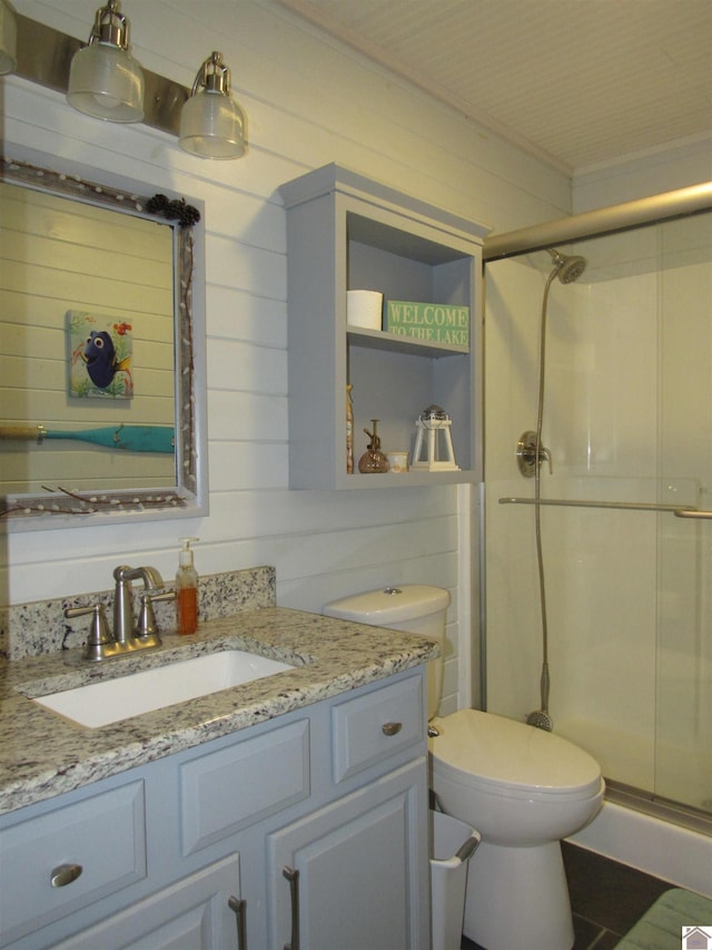 144 Canton Heights 2 Cir, Cadiz, KY 42211 - bathroom with vanity, a stall shower, toilet, ornamental molding, and wooden walls