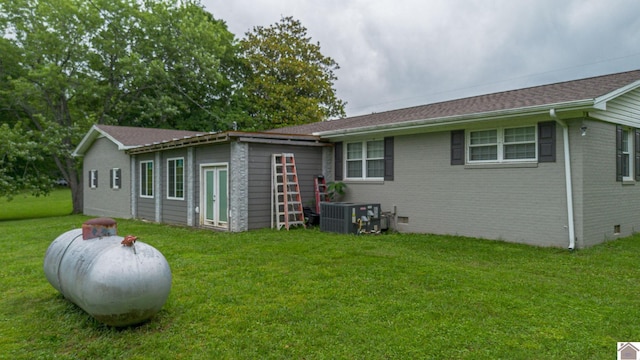 3561 Beal, Hardin, KY 42048 - rear view of house with a yard, brick siding, and crawl space