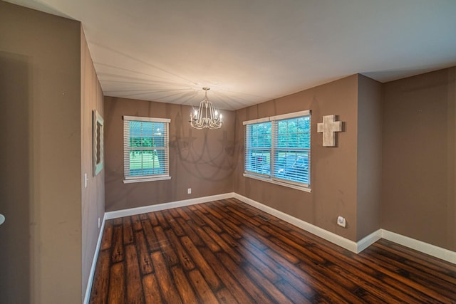 3561 Beal, Hardin, KY 42048 - unfurnished room featuring a chandelier and dark wood finished floors