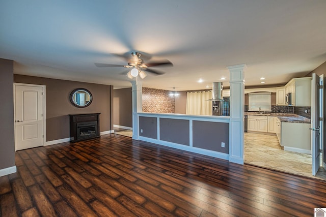 3561 Beal, Hardin, KY 42048 - unfurnished living room featuring light wood-style floors, a ceiling fan, and a fireplace