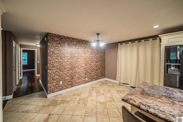 3561 Beal, Hardin, KY 42048 - dining area with brick wall, light tile patterned floors, and recessed lighting