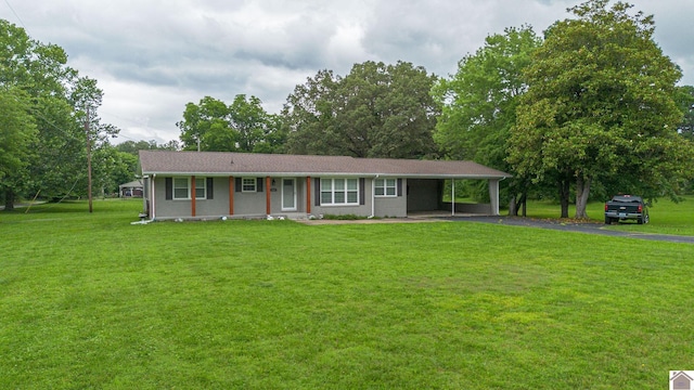 3561 Beal, Hardin, KY 42048 - single story home with asphalt driveway, a front lawn, an attached carport, and view of wooded area