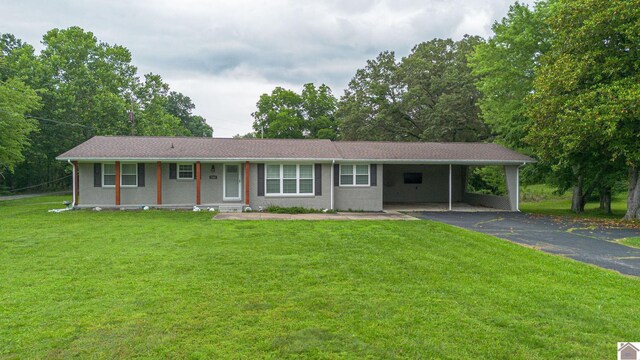 3561 Beal, Hardin, KY 42048 - ranch-style home with asphalt driveway, a front lawn, and a carport