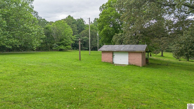 3561 Beal, Hardin, KY 42048 - view of green lawn with an outdoor structure and a garage