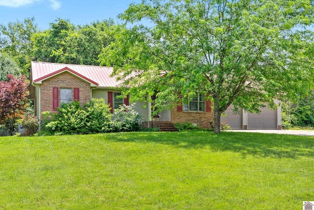 332 Meadowbrook, Cadiz, KY 42211 - view of front of house featuring brick siding, a front yard, concrete driveway, and metal roof