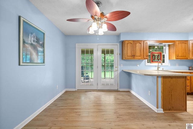 332 Meadowbrook, Cadiz, KY 42211 - kitchen featuring light countertops, light wood-type flooring, and baseboards