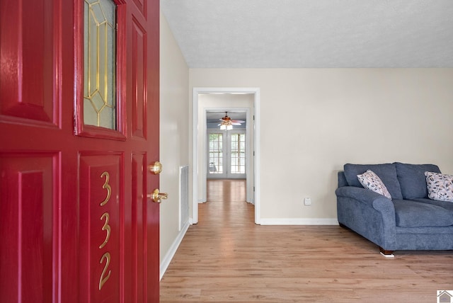 332 Meadowbrook, Cadiz, KY 42211 - foyer with light wood-style floors, baseboards, ceiling fan, and a textured ceiling