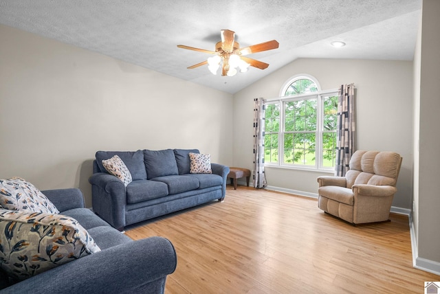 332 Meadowbrook, Cadiz, KY 42211 - living room featuring lofted ceiling, a ceiling fan, light wood-style flooring, baseboards, and a textured ceiling