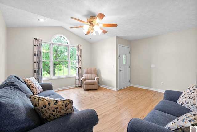 332 Meadowbrook, Cadiz, KY 42211 - living room with light wood-style flooring, ceiling fan, lofted ceiling, baseboards, and a textured ceiling