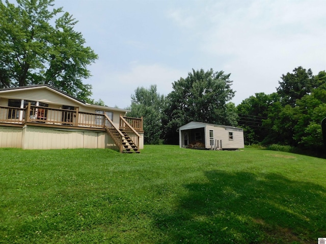 920 State Route 506, Marion, KY 42064 - view of green lawn featuring a wooden deck, an outbuilding, and stairway