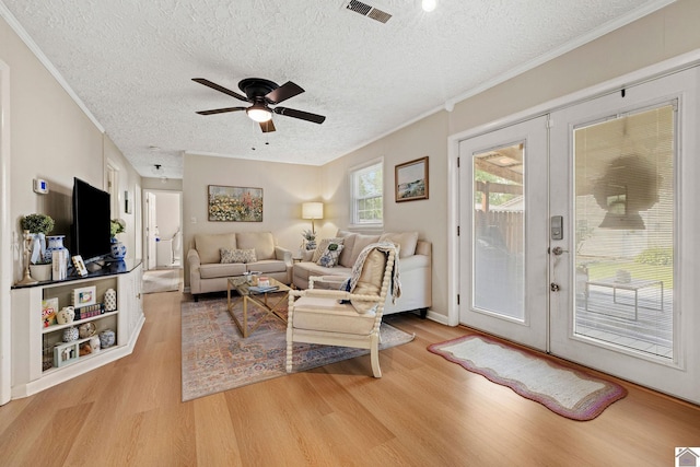 2145 Blankenship, Paducah, KY 42003 - living room with light wood-type flooring, french doors, a textured ceiling, a ceiling fan, and crown molding