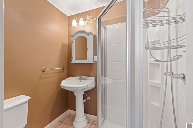 2145 Blankenship, Paducah, KY 42003 - full bathroom with a shower stall, tile patterned floors, and a textured ceiling