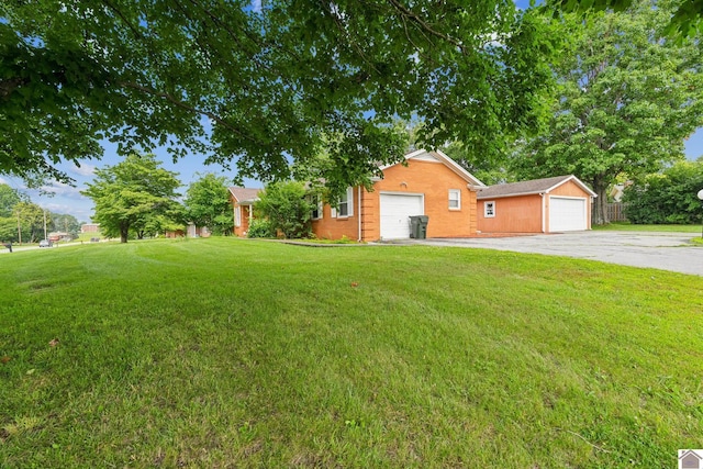 200 Millbrooke Dr, Hopkinsville, KY 42240 - view of grassy yard with a garage and an outdoor structure