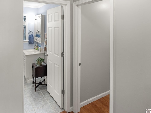 2488 Cypress Trl, New Concord, KY 42076 - corridor with crown molding and a sink