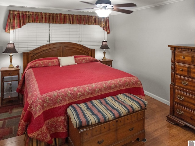 2488 Cypress Trl, New Concord, KY 42076 - bedroom with crown molding, wood finished floors, and a ceiling fan