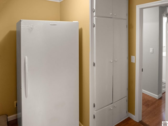 2488 Cypress Trl, New Concord, KY 42076 - detailed view of freestanding refrigerator and wood finished floors