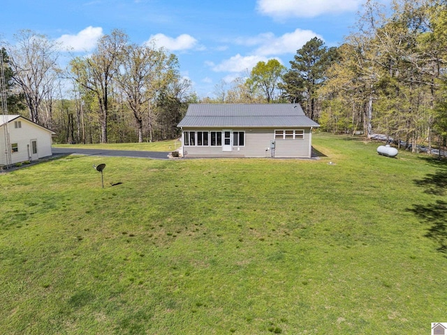 2488 Cypress Trl, New Concord, KY 42076 - back of house featuring a yard and a metal roof