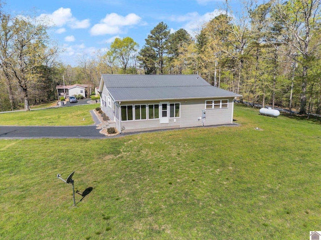 2488 Cypress Trl, New Concord, KY 42076 - view of front facade featuring a front yard and a metal roof