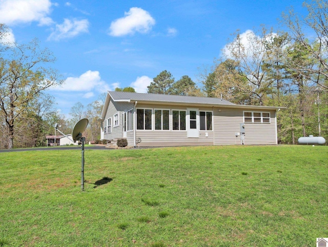2488 Cypress Trl, New Concord, KY 42076 - view of front of house featuring a front yard and a sunroom