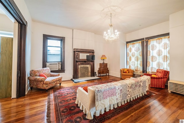 326 N 9th, Paducah, KY 42001 - living room with hardwood / wood-style floors, a chandelier, a fireplace with raised hearth, and cooling unit