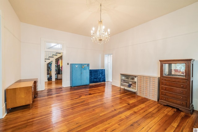 326 N 9th, Paducah, KY 42001 - unfurnished living room featuring hardwood / wood-style flooring and a chandelier
